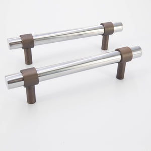 
                  
                    Stainless Steel Cabinet Pull with Bronze Rings
                  
                